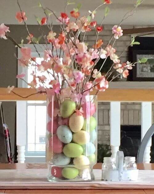 Fake cherry blossom branches and colored eggs