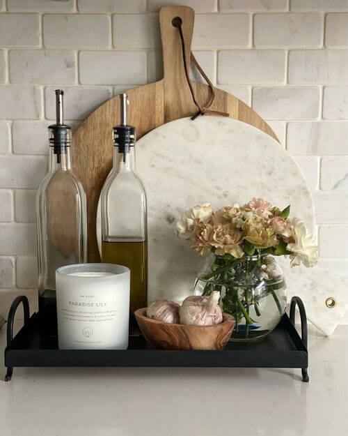 Black tray with condiments and decor