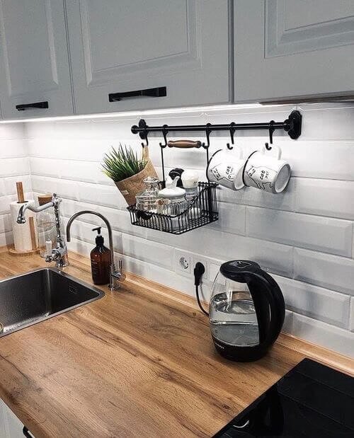 Hanging bar for cups and plants