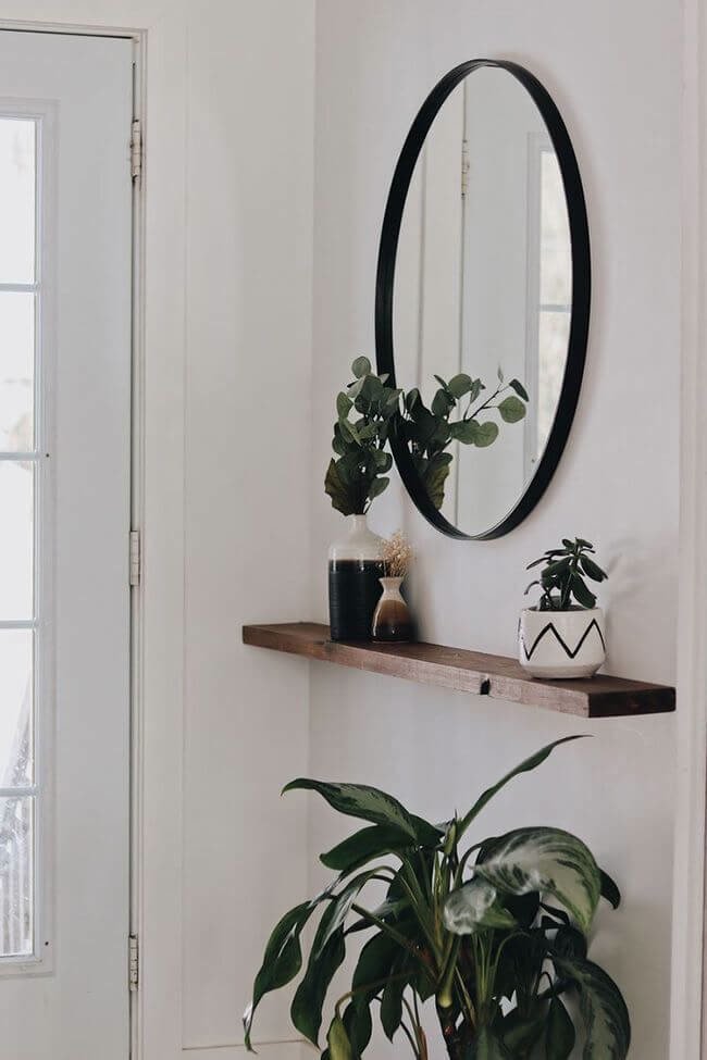 Narrow Entryway With a Wall-Mounted Shelf