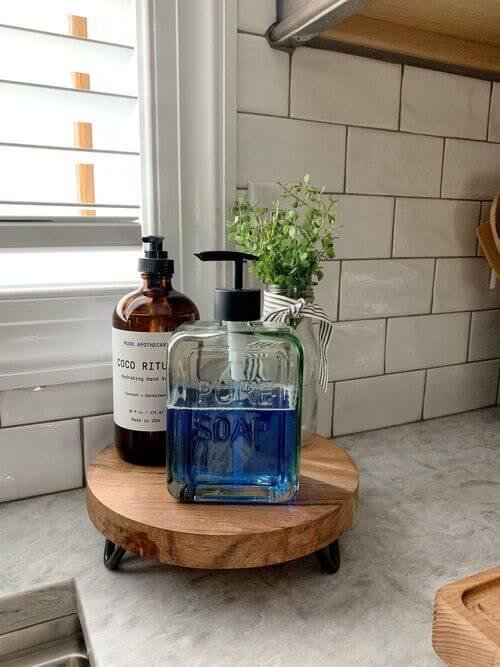 Soap pump on a mini wooden riser
