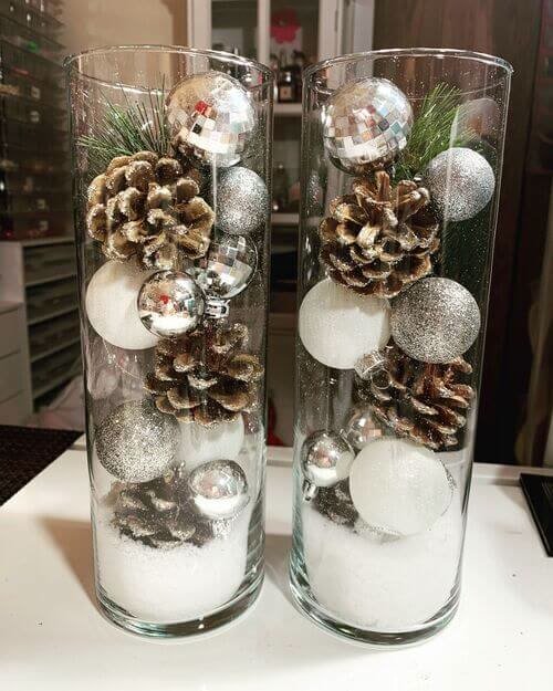Cylinder vases filled with Christmas ornaments