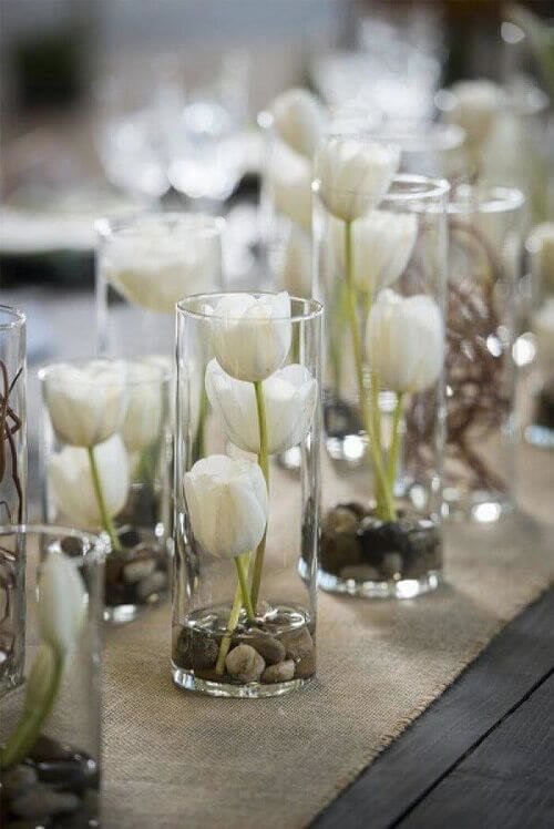 Jars with pebbles and flowers
