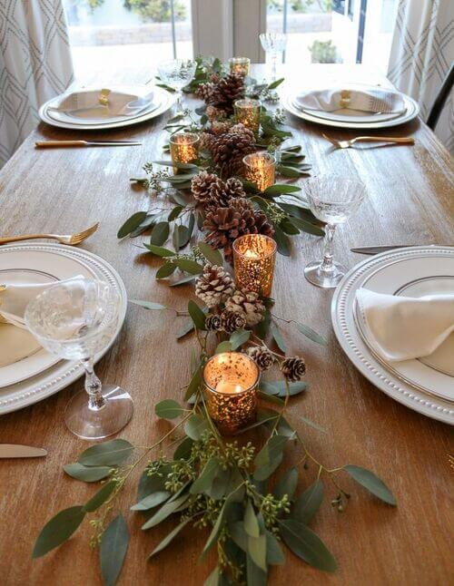 Simple Christmas table decor with greenery and speckled tealight holders
