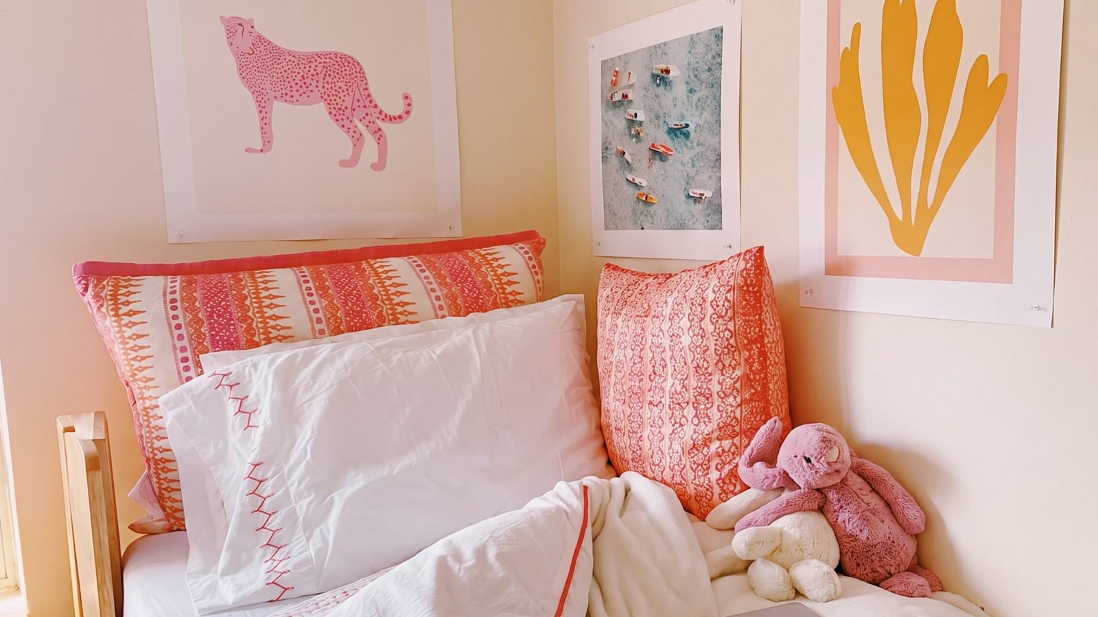 Preppy college dorm room with pink and coral decor