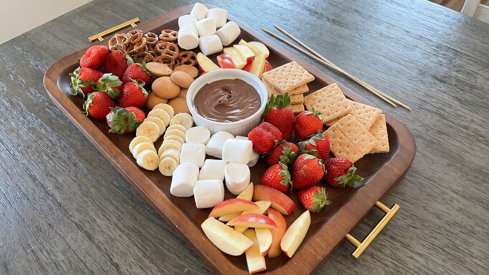 Chocolate fondue snack board for a graduation party
